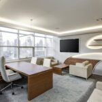 Sleek office space featuring contemporary furniture and city skyline views, ideal for professionals.